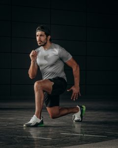 man-in-white-crew-neck-t-shirt-and-black-shorts-sitting-on-floor-qzp60ft380e